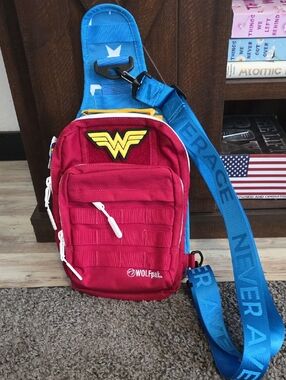 WOLFPAK 9l Red Wonder Woman Emblem Sling Bag with Blue Strap